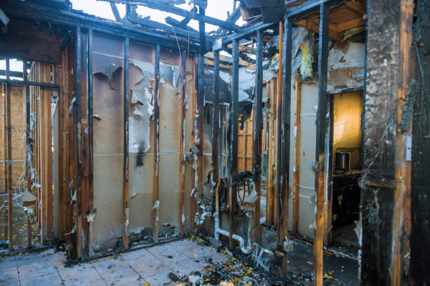 Professional Fire Damage Restoration technician working in Concord, NH